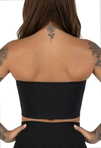 Model wearing compression chest binder with natural movement and all-day comfort support