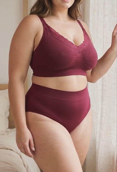 Curvy model wearing burgundy cotton rich high cut brief, showing the full-coverage fit and comfort waistband